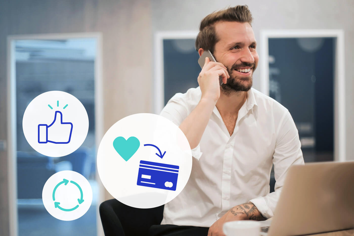 Man in an office talking on a cell phone with icons of a thumbs up, a heart and credit card, and a circle made up of arrows