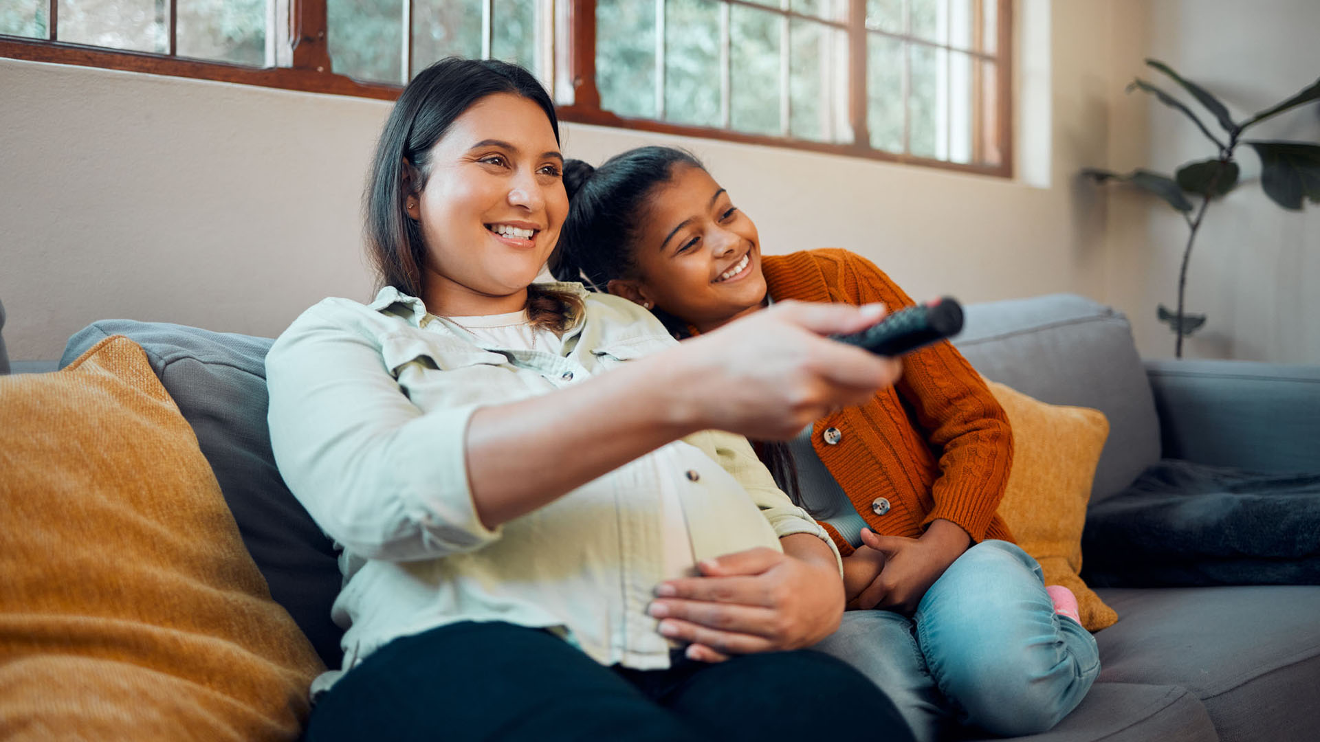 mom and daughter watch tv